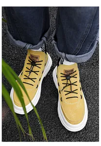 A top view of stylish yellow fashion platform casual shoes with white thick soles