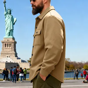 Detailed side view of a khaki heavy-duty warm men's work jacket in an outdoor setting.