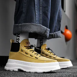 Stylish yellow high-top platform casual sneakers for men with thick white soles and black laces