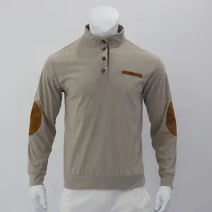 Close-up of men's corduroy stand-collar sweater with elbow patches and button detail