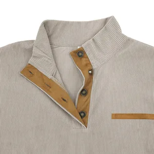 Close-up detail of a men's casual corduroy sweatshirt featuring a stand collar and snap buttons