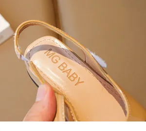 Detailed macro view of MG BABY girls beige patent leather sandal logo insole