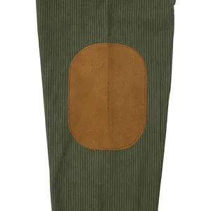 Close-up view of a green corduroy sweatshirt sleeve featuring a brown oval elbow patch