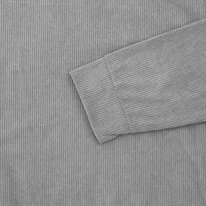 Detail shot of grey corduroy fabric texture and sleeve cuff on men's sweatshirt