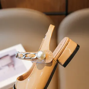 Elegant beige patent leather girls' sandals with decorative pearl and chain