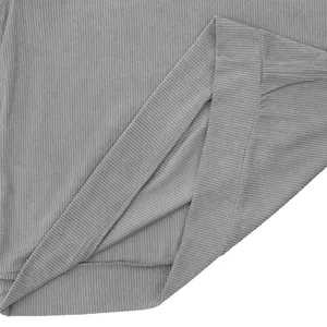 Close-up detail showing the texture of gray corduroy fabric on a men's casual sweatshirt hem
