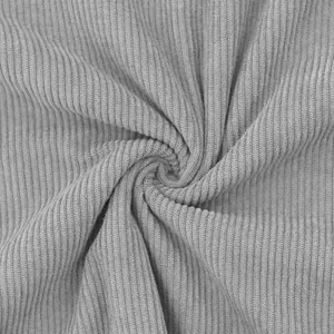 Macro detail showing the soft vertical ribbed texture of grey corduroy fabric material.