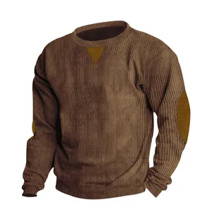 Detailed view of men's brown corduroy sweatshirt with crew neck and elbow patches