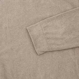 Close-up of khaki corduroy fabric and sleeve cuff detail for men's casual sweatshirt