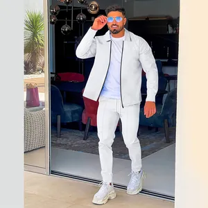 Stylish men's white waffle knit tracksuit set featuring a zip-up jacket and trousers
