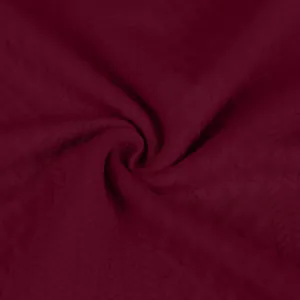 Vista detallada de tela jacquard texturizada color burdeos para chaqueta de hombre