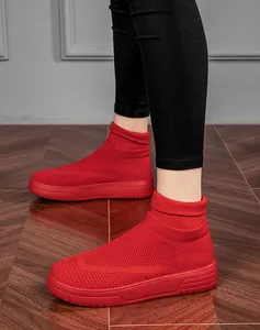 Close-up detail showing breathable mesh material of red high-top fly-knit sock sneakers