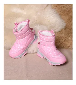 Warm pink winter snow boots for kids with white snowflake patterns and plush fur lining.