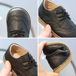 Breathable black soft leather children's shoes with classic brogue wingtip details