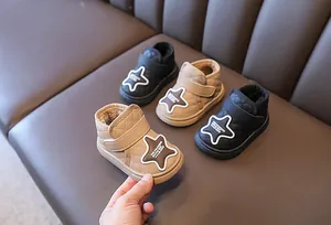 Detailed view of warm quilted toddler snow boots featuring plush lining and star patches