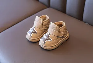 Close-up of khaki quilted toddler snow boots with warm plush fleece lining and star patch