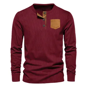Close-up detail of men's casual burgundy corduroy long sleeve Henley shirt with chest pocket