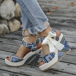 Bohemian wedge peep-toe sandals with floral print and a stylish white bow ribbon