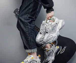 Men's stylish grey and white chunky dad sneakers with thick platform soles