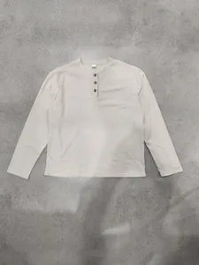 Full view of men's beige corduroy long-sleeve henley shirt with button details