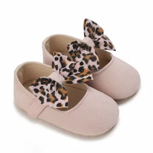 Detailed view of pink baby girl soft sole princess shoes with stylish leopard print bow