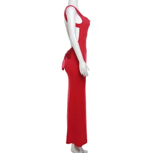 Detailed side view of a red backless evening maxi dress with a large decorative bow