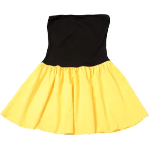 Contrast color tube top dress with black bodice and yellow pleated skirt