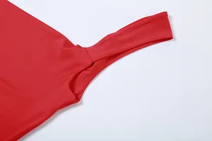 Detail view of a red bodycon dress strap showing high-quality fabric and stitching