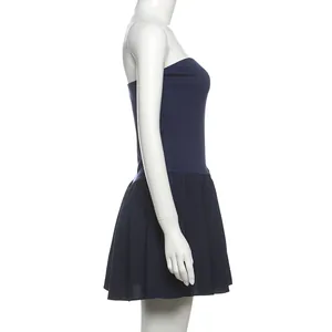 Side profile of a navy blue strapless pleated slim fit dress shown on a mannequin