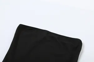 Macro view of the high-quality elasticized stitching on a black off-shoulder dress