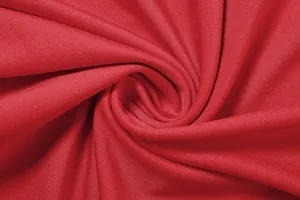 Close-up of the smooth red fabric texture showing the fine knit details and material