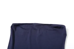 Macro detail of the neat stitching on a navy blue slim-fit off-the-shoulder dress