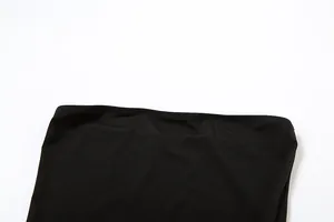 Detailed macro view of the stitching and fabric texture on a black off-shoulder dress