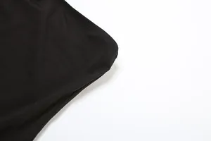 Close-up of the high-quality black fabric texture and durable stitching on this women's dress