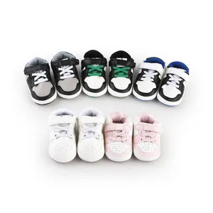 Assorted colors of infant walking sneakers for babies 0-1 year old in white studio