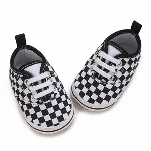 Classic black and white checkered baby walking shoes with soft soles