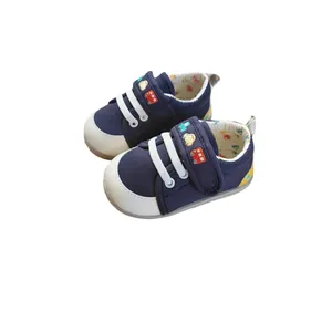 Navy blue baby walking shoes featuring embroidered car patterns and flexible soft soles