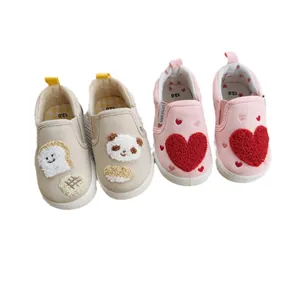 Soft sole children's canvas walking shoes with cute cartoon embroidery for toddlers.