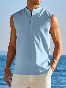 Close-up of a men's light blue sleeveless half-button shirt on a beach background