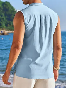 Back view of light blue sleeveless shirt with textured fabric and beach background