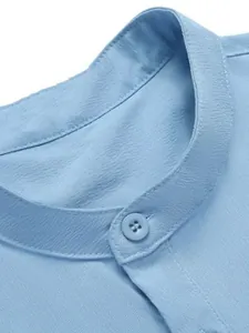 Detailed close-up of light blue stand collar and textured fabric for men's casual vest
