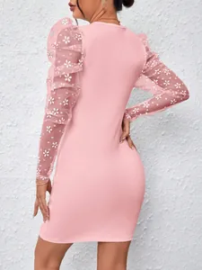 Detailed view of the floral mesh puff sleeves on this stylish pink bodycon dress