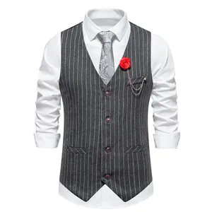 Front detail of a grey pinstripe men's vest with red rose boutonniere and paisley tie.