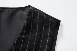 Detailed view of vintage pinstripe wool fabric and smooth lining of men's vest detail