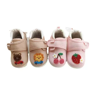 Soft-soled baby walking shoes with cute embroidered animal and fruit patterns for toddlers.