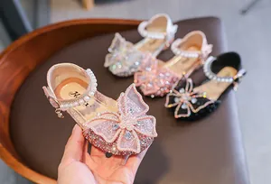 Elegant pink girls' princess sandals with sparkly rhinestones and a lace butterfly bow detail
