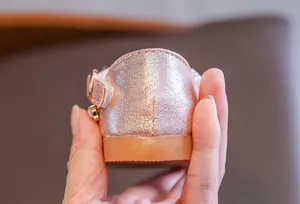 Close-up of glittery pink girl's shoe heel with durable gum sole and side charms
