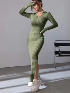 Detail view of slim fit green ribbed long sleeve dress with polo collar and slit