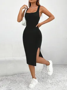Detailed shot of black ribbed slim-fit midi dress featuring a square neck and side slit