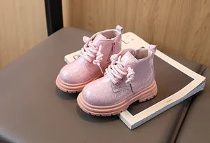 Sparkly pink glitter Martin boots for girls featuring a convenient side zipper and stylish lace-up design